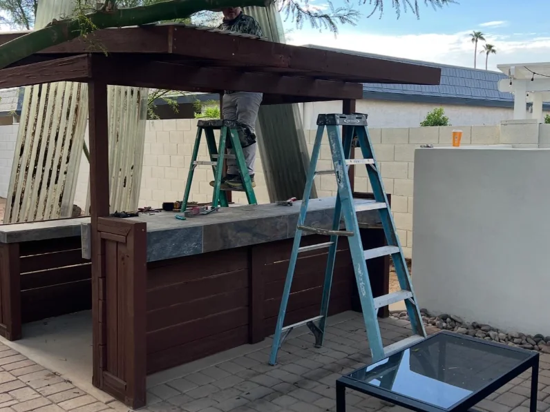 Before: dark wood backyard bar